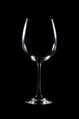 Elegant glass of wine isolated on black background