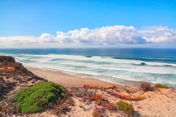 The sea and the blue waves of the coast of Portugal. Seascape su