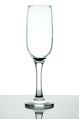 Empty wine glass on a leg on a white background.