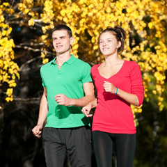 Young man and woman jogiing