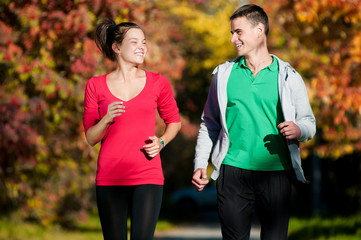 Young man and woman running