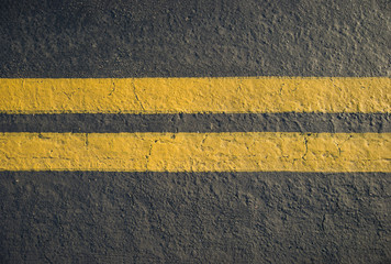 double yellow lines divider on blacktop