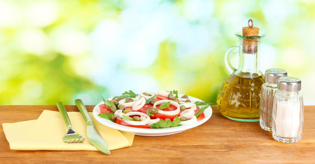 Salad with capers in the plate on bright green background