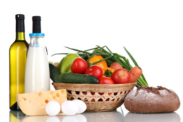 Composition with vegetables  in wicker basket isolated on white