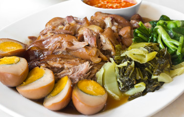 Stewed pork leg with five spices, served with eggs and pickle