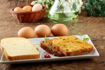 White bread with fried egg and parsley