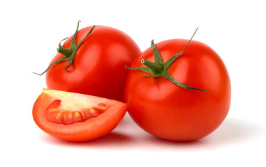 Red tomato vegetable with cut closeup isolated on white backgrou