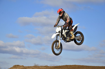 Flight of motorcycle racer MX forward inclined