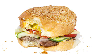 Bitten burger with crumbs isolated on white