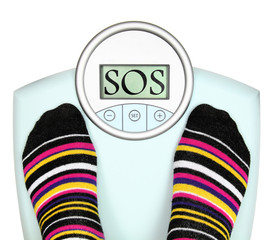 Woman' s feet on weighing scale