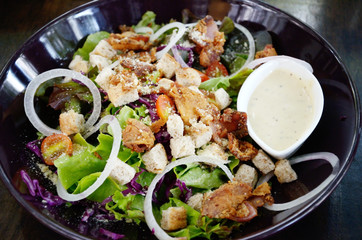 Salad in black dish