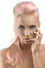 blonde girl with coloured make-up and hand on the face
