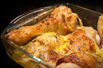 Fototapeta premium Chicken legs baked with mayonnaise and cheese