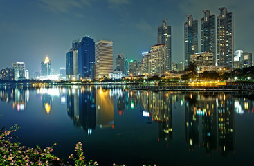Naklejka na ściany i meble Bangkok in evening, reflection of buildings in water