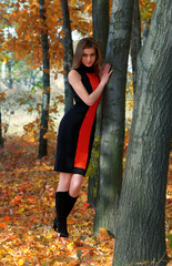 hot young woman in autumn park