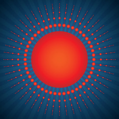 Red sun with rays on blue sky