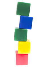 Children's pyramid from color cubes isolated on white background