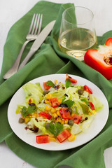 salad with corn and balsamic sauce on the plate