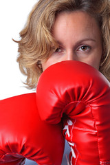 Woman wearing boxing gloves close up