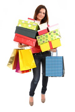 Happy woman with shopping bags and gifts