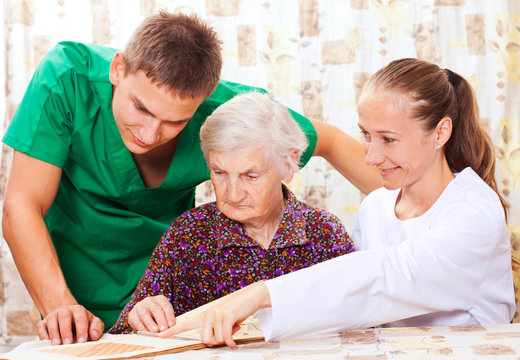Elderly woman with the young doctors
