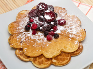 Wafers with berries and powdered sugar