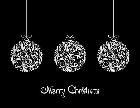 Three White Christmas balls on black background.