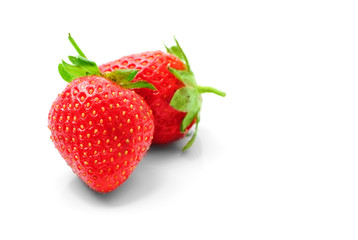two strawberries isolated on a white background