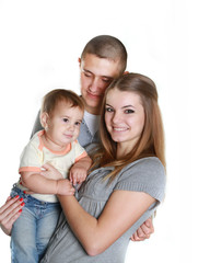 young happy family with child, studio portrait, isolated over wh