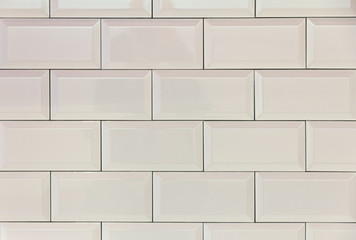 Wall background with bright white tiles