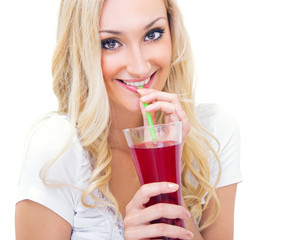 Young woman drinking lemonade, studio-shot
