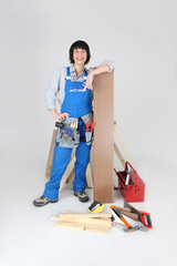 Woman about to lay laminate flooring