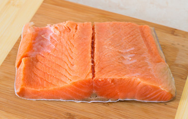 Trout fillet on wooden background