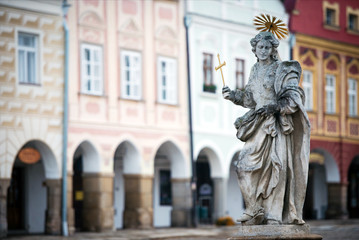 Fototapeta na wymiar Statue on fountain at the main square of Telc, Czech republic