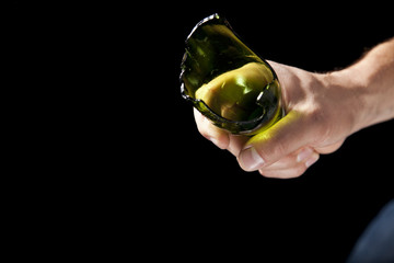 Broken beer bottle in hand