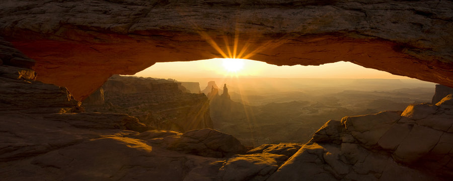 Sunburst Through Mesa Arch In Utah's Canyonlands National Park