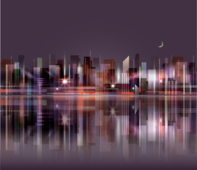 City skyline at night with reflection in water