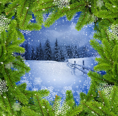 Naklejka na ściany i meble Frame the branches of pine on a background a winter landscape