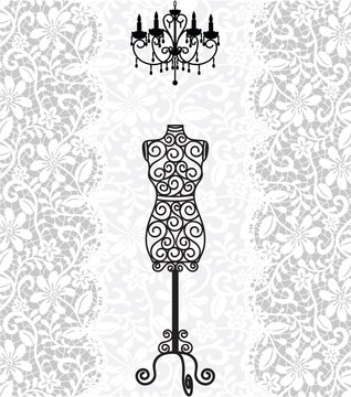 mannequin and chandelier on lace background