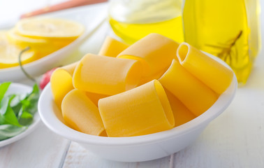 raw pasta with aroma spice and oil in the bottle