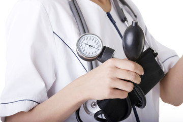 Woman doctor with blood pressure gauge