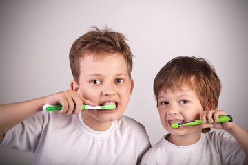 two happy boys with tooth brush