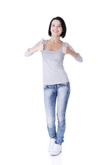 Beautiful young woman gesturing thumbs up.