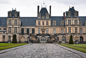 Entrance to the Chateau de Fontainebleau on a rainy day, France