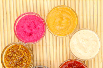 various sauces on bamboo mat