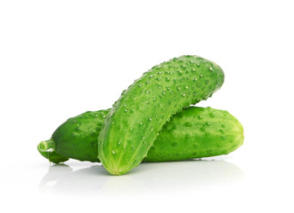 green cucumbers on white