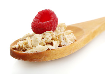 tasty oatmeal with raspberry and mint in spoon, isolated