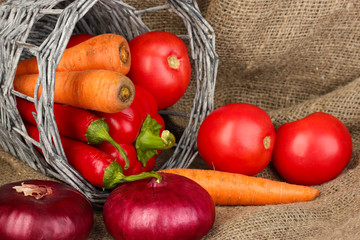 fresh red vegetables on sackcloth background