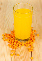 sea buckthorn juice in a glass beaker