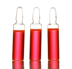 medical ampules with red liquid, isolated on white